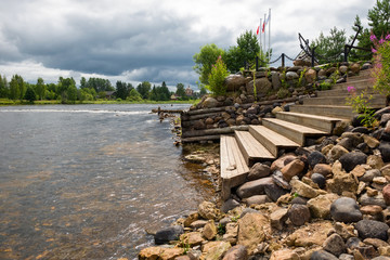 A staircase descends to the river.