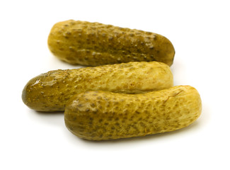 Marinated pickled cucumbers on white background