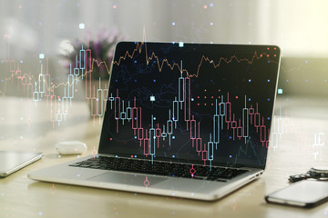 Double exposure of abstract creative financial diagram on modern laptop background, banking and accounting concept