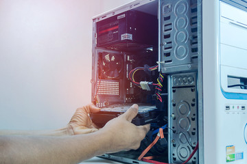 Technician repair graphic card cleaning computer pc. In the computer service center