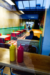 Stockholm, Sweden A man eats alone in a hamburger restaurant.