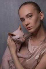 portrait of a woman with cat Felis catus  sphinx