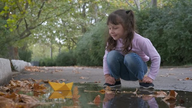 Paper ship in the water.