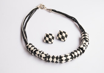 Isilated geometric jewelry set. Black and white necklace and earrings of polymer clay.