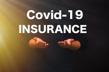 Covid-19 Insurance, hand's with with a text 