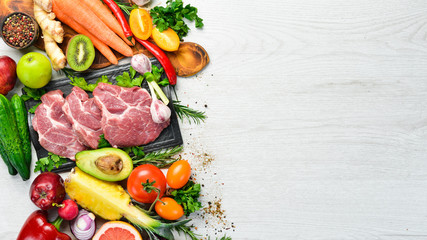 Protein menu: veal meat, vegetables and fruits. Food background.
