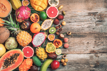 Assortment of tropical fruits concept. Exotic fruits - pineapple, papaya, mango, annona, banana, pitahaya, kiwano, african horned melon, tamarillo fruit, granadilla, salak, snake fruit, maracuya