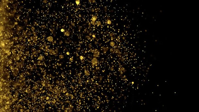 Golden glitter background in slow motion. Gold dust bokeh abstract background.