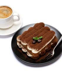 Classic tiramisu dessert on ceramic plate and cup of coffee isolated on white background with clipping path