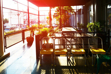 Yellow and green chair  at relax corner in front of the hotel with orange sunlight of afternoon   at Bangkok Thailand