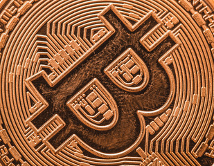 Close up of failing cryptocurrency sign bitcoin coin, finance and stock exchange concept, macro image