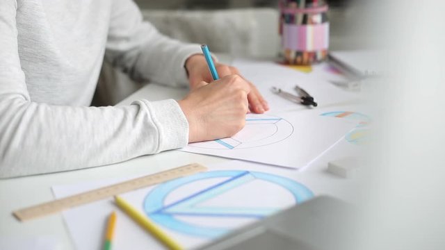 Designer illustrator draws sketches of logos for the brand.