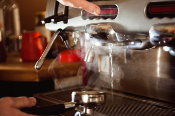 close up barista hand making a cup of coffee