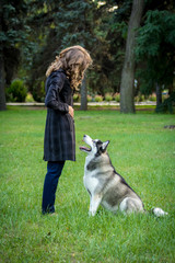 Young woman and dog in the park