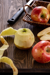 Fresh and juicy red apples in a basket on a wooden table