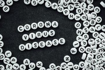 Words CORONA VIRUS DISEASE made from small white letters on black background