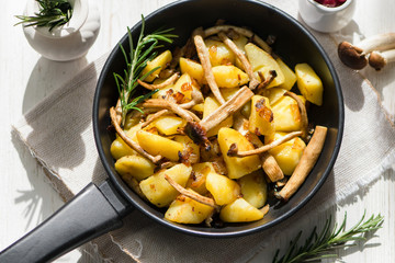 delicious fried potatoes with mushrooms, onions and cranberries