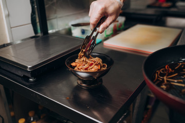 Japanese cuisine chef prepares dishes