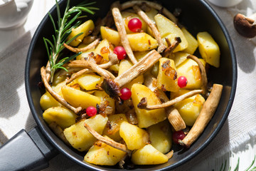 delicious fried potatoes with mushrooms, onions and cranberries