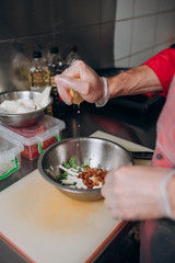 Japanese cuisine chef prepares dishes