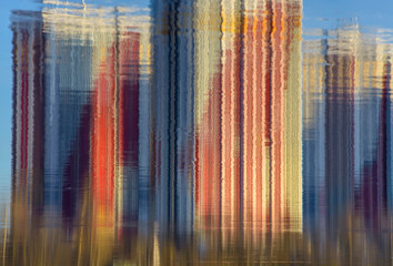 Abstract picture reflection of high-rise buildings in the river.