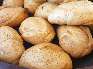 Macro bread. Small rolls of wholemeal bread in a basket.