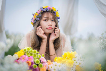 Beautyful Asian woman in the flower garden