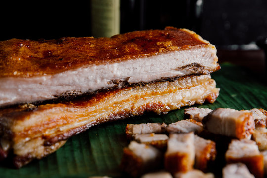 Oriental Roast Pork Belly on wooden chopping board