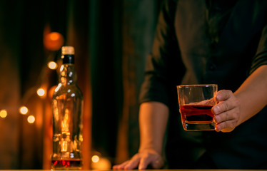 Bartender Serve Whiskey, on wood bar..