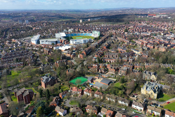 Aerial photo over looking the area of Leeds known as Headingley in West Yorkshire UK, showing a typical British hosing estates and roads taken with a drone on a sunny day