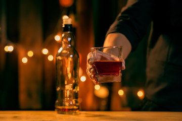 Barman pouring whiskey whiskey glass beautiful night