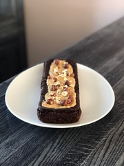 Vegan chickpea chocolate brownie with peanut butter and hazelnuts