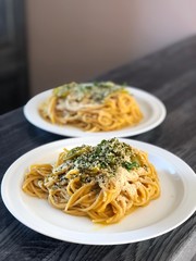 Creamy vegan whole wheat pasta spaghetti with pumpkin sauce