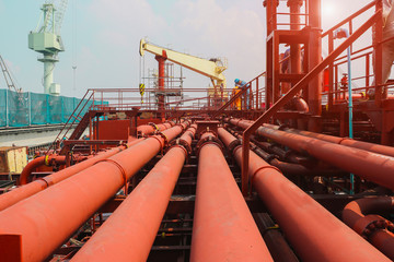 Pipe line on oil tanker storage ship in shipyard under repair and maintenance