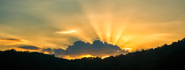 Panorama summer sunset golden cloud summertime light sunny day cloudscape mountain scene. Panoramic sunset golden skyline sun beam over cloud climate background. Heaven gold landscape panoramic banner