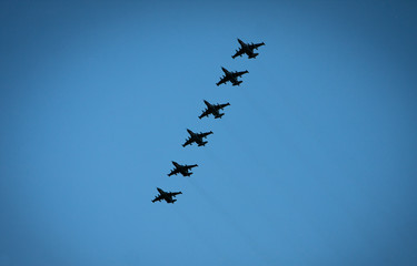 Naklejka na ściany i meble Link of 6 combat aircraft in the sky