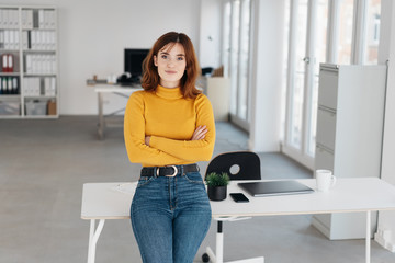 Young businesswoman staring quietly at the camera