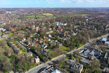 Aerial photo over looking the area of Leeds known as Headingley in West Yorkshire UK, showing a typical British hosing estates and roads taken with a drone on a sunny day