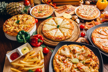 Fototapeta na wymiar Italian Pizza on wooden table