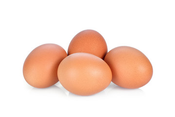 four chicken eggs isolated on white background