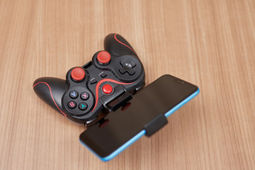 gamepad, with a smartphone, seen from behind and above