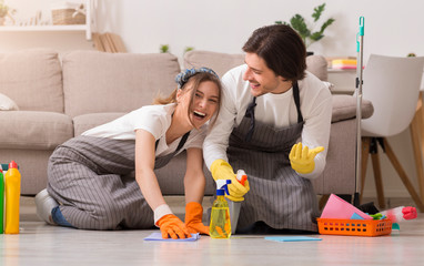 Spring-Clean. Young Couple Having Fun While Cleaning House, Washing Floor Together