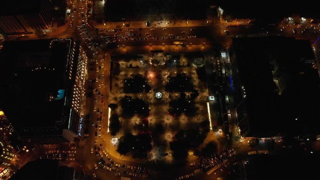 Syntagma square by night aerial drone shot on top of square