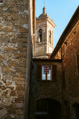 Medieval street in old Italian hill town. Tuscany, Italy