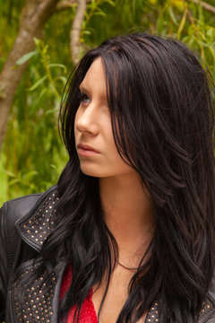 Young woman outside wearing a black leather jacket