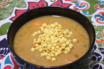 Vegetables soup with yellow croutons