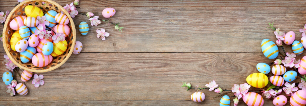 Gift card with colorful easter eggs on old wooden table.