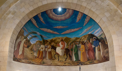 Fototapeta premium Bethphage, Israel, January 30, 2020: Fresco at Betfage on the Mount of Olives showing the entry of Jesus to Jerusalem