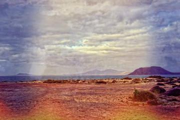 landscape from the Spanish Canary Island Fuerteventura with dunes and the ocean