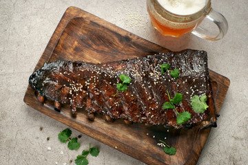 smoked pork ribs with coriander and a glass of beer